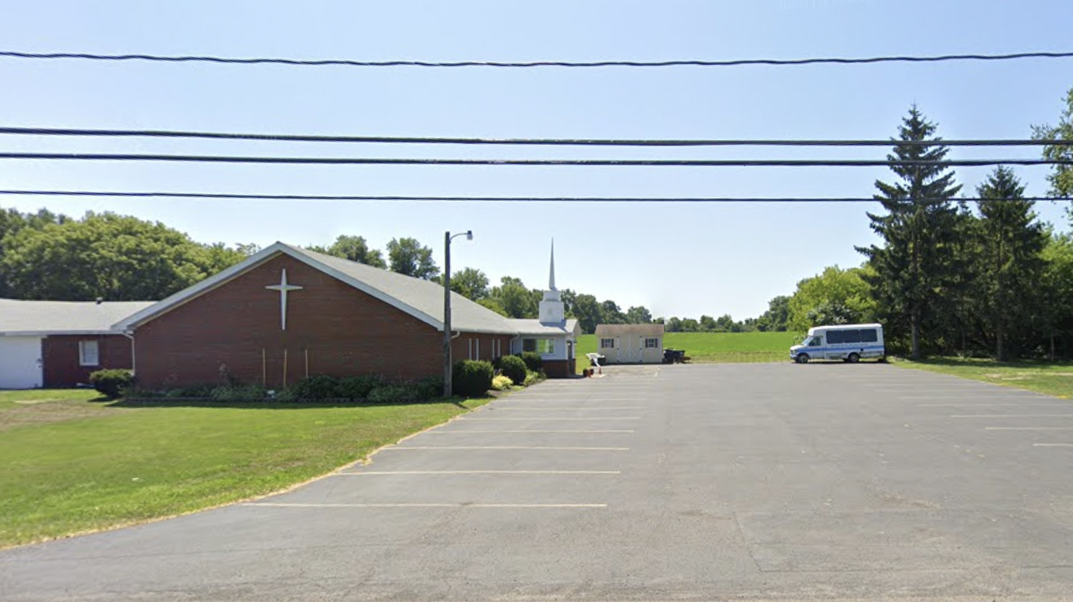 Landmark Free Will Baptist Church's parking lot and building